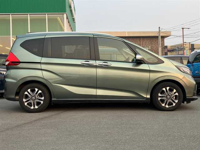 ホンダ フリード クロスター 愛知県 2022(令4)年 1.4万km シルバーミストグリーンM エンジンスタートボタン/スマートキー/アイドリングストップ/オートエアコン/パワーステアリング/パワーウィンドウ/クルーズコントロール/ETC/USB入力端子/バックカメラ/SDナビ（CD.DVD.BT.フルセグ）/ドライブレコーダー/純正フロアマット/純正アルミホイール/両側パワースライドドア/D席N席シートヒーター/D席N席エアシート/ABS/横滑り防止装置/レーンキープアシスト/オートライト/コーナーセンサー/W+サイドエアバック/カーテンエアバック/衝突軽減システム