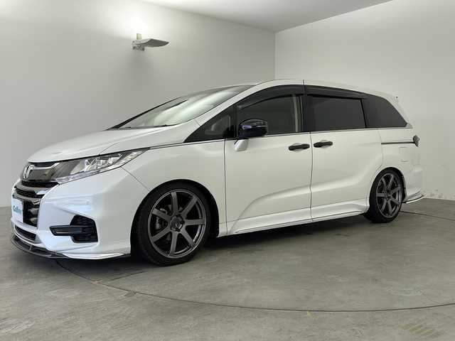 ホンダ オデッセイ アブソルート ホンダセンシング 兵庫県 2018(平30)年 5万km プラチナホワイトパール ・社外アンダーエアロ/・ENKEi 19インチAW/・純正9インチナビ＆BT＆TV＆CD＆DVD＆SD/・両側パワースライドドア/・衝突軽減ブレーキ/・車線逸脱警報/・レーダークルーズコントロール/・パーキングセンサー/・LEDヘッドライト/・ビルトインETC2.0/・バックカメラ/・スマートキー/・ハーフレザーシート/・社外テールランプ/・アイドリングストップ/・純正フロアマット/・ダブルエアコン/・スペアキー