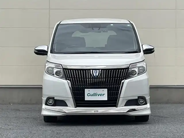 トヨタ エスクァイア ハイブリッド Gi ブラックテーラード 茨城県 2016(平28)年 4.2万km ホワイトパールクリスタルシャイン プッシュスタート/スマートキー/スペアキー/保証書付き/取扱説明書/モデリスタエアロ（前横後）/Bluetooth接続/フルセグTV/クルーズコントロール/両側パワースライド/オートマチックハイビーム/オートライト/バックカメラ/前席シートヒーター/衝突被害軽減システム/ブラックレザーシート