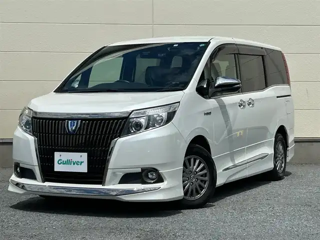 トヨタ エスクァイア ハイブリッド Gi ブラックテーラード 茨城県 2016(平28)年 4.2万km ホワイトパールクリスタルシャイン プッシュスタート/スマートキー/スペアキー/保証書付き/取扱説明書/モデリスタエアロ（前横後）/Bluetooth接続/フルセグTV/クルーズコントロール/両側パワースライド/オートマチックハイビーム/オートライト/バックカメラ/前席シートヒーター/衝突被害軽減システム/ブラックレザーシート