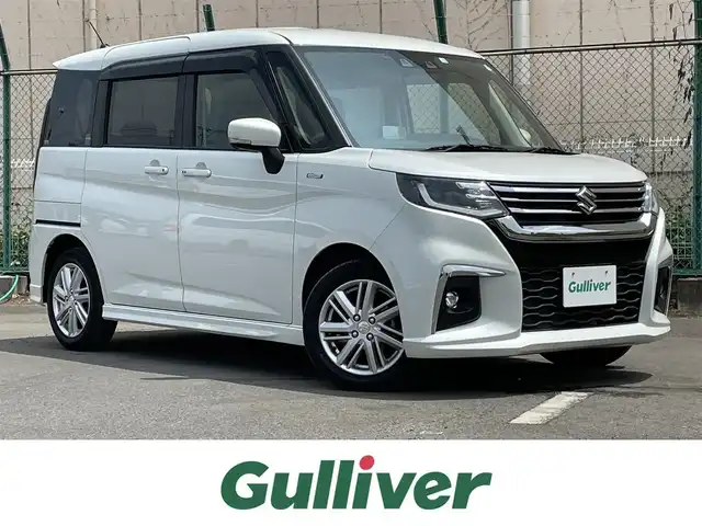 スズキ ソリオ HV MZ 東京都 2022(令4)年 2.7万km ピュアホワイトP 純正ナビ/バックモニター/デュアルカメラブレーキサポート/車線逸脱警報機能/パーキングソナー/シートヒーター/アダプティブクルーズ/両側電動ドア/横滑り防止措置/ETC/ステアリングスイッチ