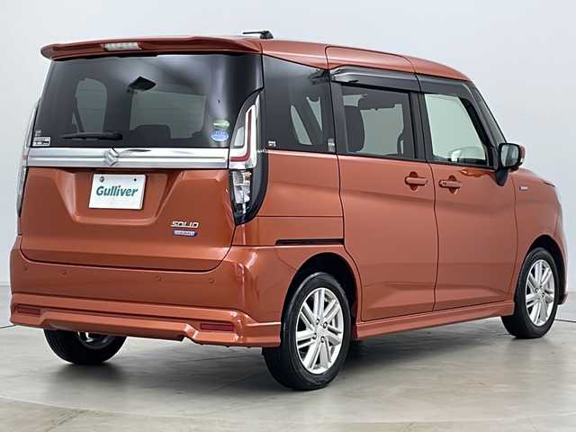 スズキ ソリオ HV MZ 道央・札幌 2021(令3)年 3.6万km フレイムオレンジPM ・4WD/・ワンオーナー/・純正ナビフルセグTV&CD&BT&USB/・全方位カメラ/・両側パワースライドドア/・HUD/・スズキセーフティサポート/・衝突軽減ブレーキ/・誤発進抑制機能/・車線逸脱抑制機能/・リヤクロストラフィックアラート/・前席シートヒーター/・アダプティブクルーズコントロール/・後方コーナーセンサー/・ステアリングスイッチ/・純正エンジンスターター/・純正フロアマット/・社外15インチAW付スタッドレス積込/・オートライト/・LEDヘッドライト/・LEDフォグ/・アイドリングストップ/・プッシュスタート/・ETC/・スマートキー
