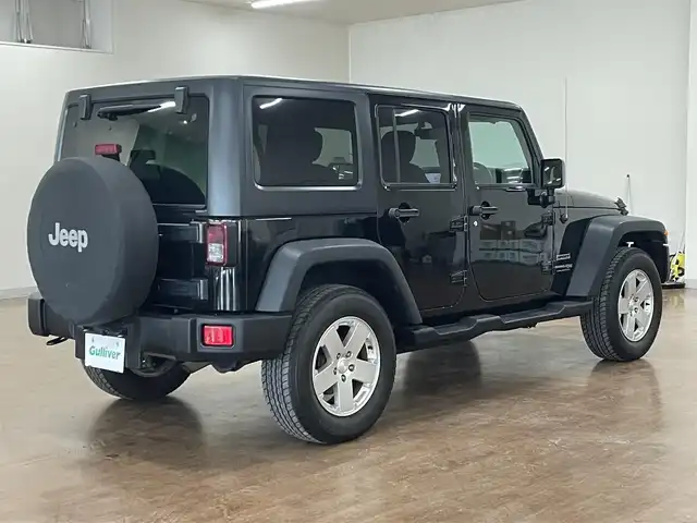 クライスラー・ジープ ジープ ラングラー アンリミテッド スポーツ 道央・札幌 2018(平30)年 7.6万km ブラック 4WD/社外メモリナビ/・フルセグTV/CD/DVD/BT/SD/バック、サイドカメラ/ETC/社外前後ドライブレコーダー/横滑り防止装置/ダウンヒルアシストコントロール/クルーズコントロール/オートライト/LEDヘッドライト/フォグライト/ヘッドライトレベライザー/純正フロアマット/サイドステップ/純正18インチAW/リモコンキー/スペアキー/背面タイヤ/社外AW付き冬タイヤ積込/・265/70R17 ’17製 6mm/新車時保証書/取扱説明書