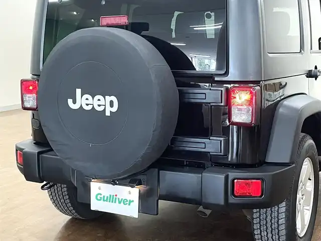 クライスラー・ジープ ジープ ラングラー アンリミテッド スポーツ 道央・札幌 2018(平30)年 7.6万km ブラック 4WD/社外メモリナビ/・フルセグTV/CD/DVD/BT/SD/バック、サイドカメラ/ETC/社外前後ドライブレコーダー/横滑り防止装置/ダウンヒルアシストコントロール/クルーズコントロール/オートライト/LEDヘッドライト/フォグライト/ヘッドライトレベライザー/純正フロアマット/サイドステップ/純正18インチAW/リモコンキー/スペアキー/背面タイヤ/社外AW付き冬タイヤ積込/・265/70R17 ’17製 6mm/新車時保証書/取扱説明書