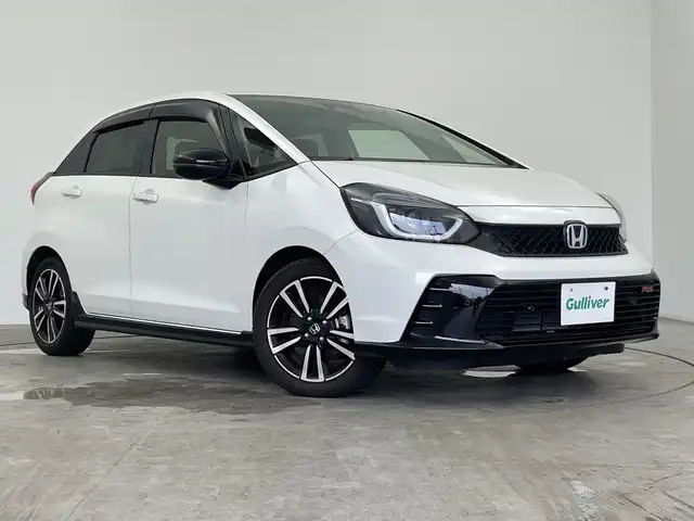 ホンダ フィット e:HEV RS 三重県 2022(令4)年 1.7万km プラチナホワイトパール 純正8インチナビ/フルセグ/バックカメラ/追従式クルーズコントロール/衝突軽減ブレーキ/レーンキープアシスト/コーナーセンサー/電動パーキング/オートブレーキホールド/前後ドライブレコーダー/ETC/パドルシフト/スマートキー