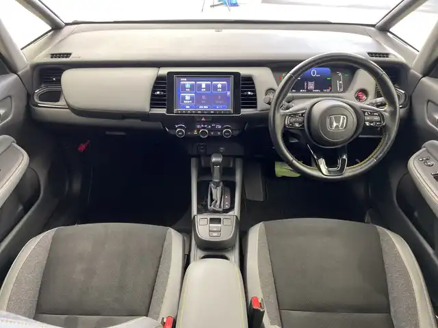 ホンダ フィット e:HEV RS 三重県 2022(令4)年 1.7万km プラチナホワイトパール 純正8インチナビ/フルセグ/バックカメラ/追従式クルーズコントロール/衝突軽減ブレーキ/レーンキープアシスト/コーナーセンサー/電動パーキング/オートブレーキホールド/前後ドライブレコーダー/ETC/パドルシフト/スマートキー
