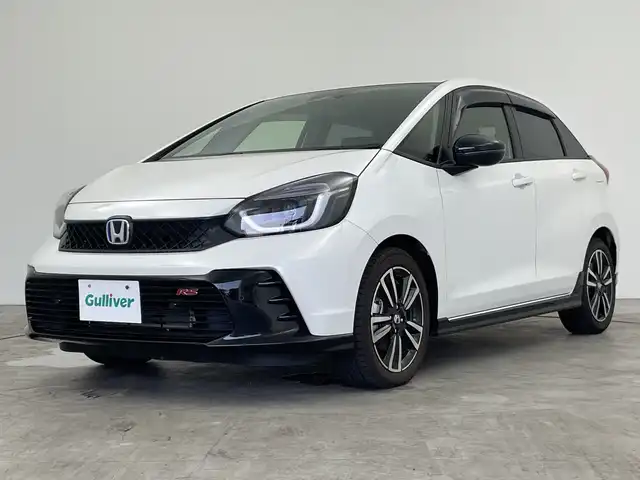 ホンダ フィット e:HEV RS 三重県 2022(令4)年 1.7万km プラチナホワイトパール 純正8インチナビ/フルセグ/バックカメラ/追従式クルーズコントロール/衝突軽減ブレーキ/レーンキープアシスト/コーナーセンサー/電動パーキング/オートブレーキホールド/前後ドライブレコーダー/ETC/パドルシフト/スマートキー