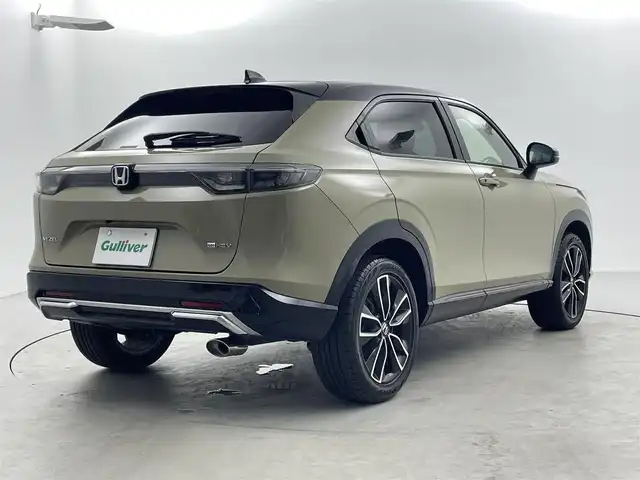 ホンダ ヴェゼル ハイブリッド e:HEV PLaY 福井県 2021(令3)年 4.9万km サンドカーキパール 純正9インチワイドナビゲーション/Honda SENSING/・衝突軽減ブレーキ/・先行者発進お知らせ機能/・レーンキープアシスト/・標識認識機能/・アダプティブクルーズコントロール/ブラインドスポットインフォメーション/後退出庫サポート/ETC2.0車載器/置くだけ充電/ヒーテッドドアミラー/熱線入りフロントウインドウ/運転席助手席シートヒーター/ハンズフリーアクセスパワーテールゲート/LEDシーケンシャルターンシグナルランプ/マルチビューカメラシステム＋プレミアムオーディオ/パノラマルーフ/コンビシート(PLaY専用)/18インチアルミホイール/保証書