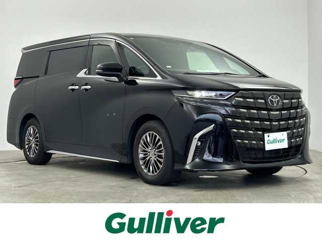 トヨタ アルファードハイブリット エグゼクティブ ラウンジ 愛知県 2023(令5)年 4.4万km ブラック トヨタセーフティー/　・プリクラッシュセーフティ/　・緊急時操舵支援/　・フロントクロストラフィックアラート/　・レーンチェンジアシスト/　・レーンディパーチャー/　・レーダークルーズコントロール/　・アダプティブハイビームシステム/　・ロードサインアシスト/　・ドライバー異常時対応システム/　・プロアクティブドライビングアシスト/　・発信遅れ告知機能/トヨタチームメイト/JBLサウンド/左右独立作動ムーンルーフ/デジタルインナーミラー/置くだけ充電/純正14インチディスプレイオーディオ/　（Bluetooth/フルセグTV/HDMI/Apple CarPlay）/ヘッドアップディスプレイ/全方位カメラ/後席14インチフリップダウン/ブラインドスポットモニター/全席パワーシート/合皮シート/全席シートヒーター・シートクーラー/後席フリップダウン専用HDMI/電動リアゲード/本革+木目ステアリング/ETC2.0