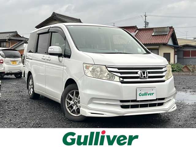 ホンダ ステップワゴン G コンフォートセレクション 岐阜県 2012(平24)年 13.2万km ホワイトオーキッドパール 純正ＨＤＤナビ　/３列シート　/両側パワースライドドア　/ビルトインＥＴＣ　/エアロ（フロント）　/クルーズコントロール　/フルフラットシート　/ウォークスルー　/オートライト/ワンセグテレビ　/純正フロアマット　/リモコンキー/アイドリングストップ/スペアキー1本/USB入力端子/チップアップシート/ABS/横滑り防止装置/盗難防止装置/エアバッグW/冷房（AAC)