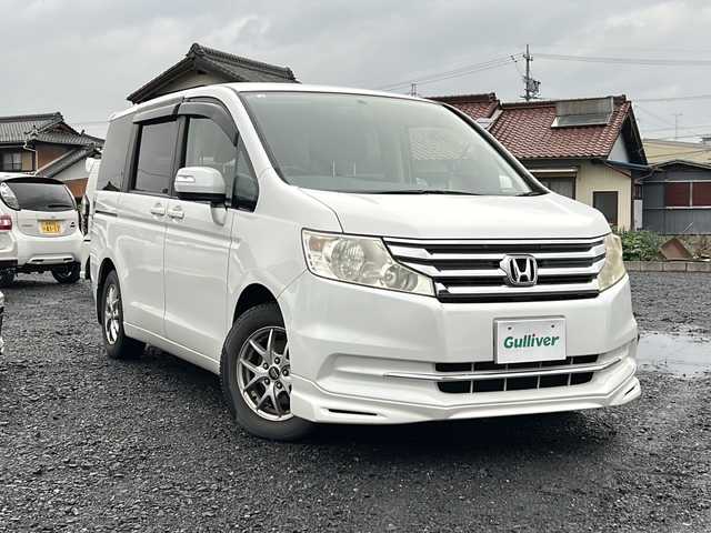ホンダ ステップワゴン G コンフォートセレクション 岐阜県 2012(平24)年 13.2万km ホワイトオーキッドパール 純正ＨＤＤナビ　/３列シート　/両側パワースライドドア　/ビルトインＥＴＣ　/エアロ（フロント）　/クルーズコントロール　/フルフラットシート　/ウォークスルー　/オートライト/ワンセグテレビ　/純正フロアマット　/リモコンキー/アイドリングストップ/スペアキー1本/USB入力端子/チップアップシート/ABS/横滑り防止装置/盗難防止装置/エアバッグW/冷房（AAC)