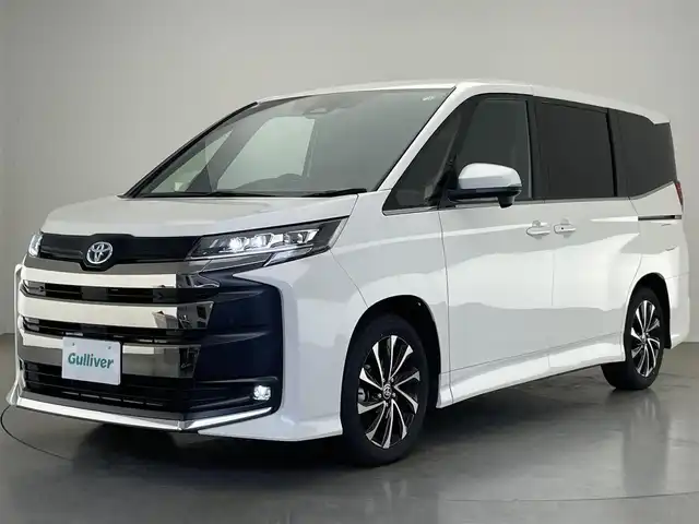 トヨタ ノア ハイブリッド S－Z 愛知県 2024(令6)年 0.6万km ホワイトパールクリスタルシャイン 純正１０．５型ディスプレイナビ　ＴＶ　ＨＤＭＩ　デジタルインナーミラー　快適利便Ｈｉｇｈ　三眼ＬＥＤライト　ＢＳＭ　降車アシスト　ドライビングサポート　セーフティセンス　衝突軽減　追従クルコン　シートヒーター　電動リアゲート　両側パワースライドドア　オットマン　ハンドルヒーター　ETC２．０　コーナーセンサー　AC100V電源　HUD　オートホールド　禁煙車