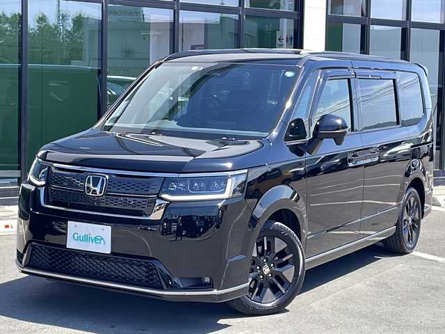 ホンダ ステップワゴン スパーダ 道東・釧路十勝 2022(令4)年 1.5万km クリスタルブラックパール /4WD//純正１１．４インチナビ(CD/DVD/TV/FM/AM/BT)//純正フリップダウンモニター//ホンダセンシング/・車線逸脱警報/・歩行者事故低減ステアリング/・先行車発進お知らせ/・衝突軽減/・パーキングセンサー警報/・ブラインドスポットインフォメーション/・アダプティブクルーズコントロール/・前後コーナーセンサー//前席シートヒーター//パワーバックドア//オートライト//スペアキー１本//ETC//両側パワースライドドア//ウインカーミラー//ステアリングスイッチ//パドルシフト//左右独立エアコン//クラッツィオシートカバー