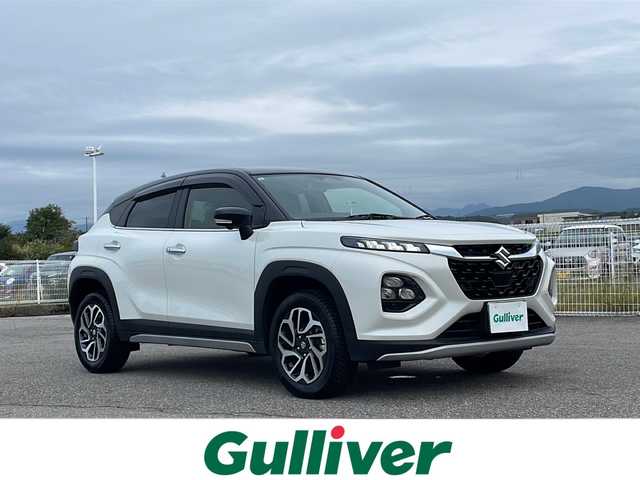 スズキ フロンクス 富山県 2024(令6)年 1.7万km 白Ⅱ 禁煙車/４ＷＤ/ワンオーナー/純正9インチディスプレイオーディオ/全方位カメラ/フルセグＴＶ/レーダークルーズコントロール/レーンキープアシスト/衝突軽減ブレーキ/ブラインドスポットモニター/コーナーセンサー/ＭＴモード付ＡＴ/ダウンヒルアシストコントロール/純正フロアマット/純正アルミホイール/シートヒーター/オートライト/ETC/スマートキー/スペアキー/保証書・記録簿/取扱説明書