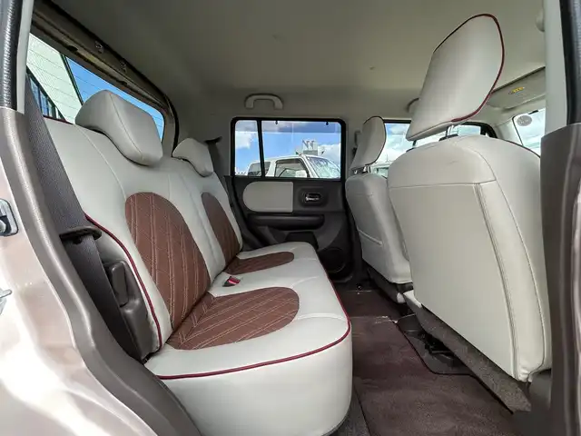 スズキ ラパン ショコラ G 鳥取県 2014(平26)年 6.1万km シャンパンピンクPM 社外ナビ/フルセグ/DVD/CD/USB/ETC/専用レザーシート/専用革巻きハンドル/専用14インチアルミホイール/専用メッキパーツ/キセノンライト/オートライト/プッシュスタートエンジン/アイドリングストップ/電動格納ミラー/フロアマット/ドアバイザー/取扱説明書/スペアキー