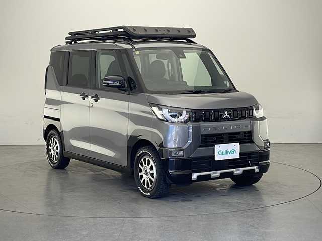 三菱 デリカミニ T 長野県 2023(令5)年 0.1万km グレーＭⅡ 4WD /ターボ/純正9インチナビ　MM222D-LM/（フルセグ/Bluetooth/AM/FM）/バックカメラ/片側電動スライドドア（ハンズフリー）/衝突軽減ブレーキ/レーンキープアシスト/前後コーナーセンサー/前席シートヒーター/ダウンヒルアシストコントロール/ハーフレザーシート/LEDヘッドライト/LEDフォグランプ/ルーフラック/ルーフレール/社外15インチAW/オープンカントリーR/T/スマートキー