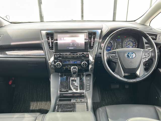 トヨタ ヴェルファイア ハイブリット ZR Gエディション 山形県 2019(令1)年 6.2万km ホワイトパールクリスタルシャイン 4WD/衝突被害軽減システム/サンルーフ/純正ナビ/（Bluetooth/CD/DVD/フルセグ)/BSM/レーダークルーズコントロール/AFS/全方位カメラ/フリップダウンモニター/両側パワースライドドア/レザーシート/JBLオーディオスピーカー/電動パーキングブレーキ/パーキングアシスト/電動リアゲート/シートメモリ/前後コーナーセンサー/D＋N席パワーシート/D＋N席シートヒーター/D＋N席エアシート/ステアリングヒーター/ビルトインETC2.0/電動格納ミラー/ウィンカーミラー/純正ホイール/純正フロアマット/オットマン/LEDヘッドライト/スマートキー