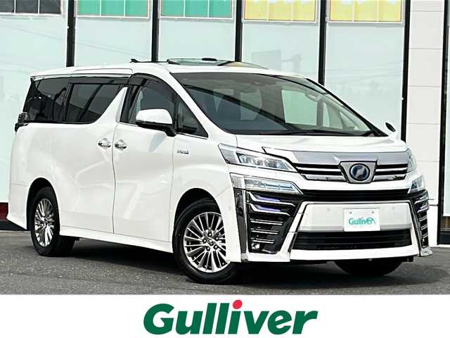 トヨタ ヴェルファイア ハイブリット ZR Gエディション 山形県 2019(令1)年 6.2万km ホワイトパールクリスタルシャイン 4WD/衝突被害軽減システム/サンルーフ/純正ナビ/（Bluetooth/CD/DVD/フルセグ)/BSM/レーダークルーズコントロール/AFS/全方位カメラ/フリップダウンモニター/両側パワースライドドア/レザーシート/JBLオーディオスピーカー/電動パーキングブレーキ/パーキングアシスト/電動リアゲート/シートメモリ/前後コーナーセンサー/D＋N席パワーシート/D＋N席シートヒーター/D＋N席エアシート/ステアリングヒーター/ビルトインETC2.0/電動格納ミラー/ウィンカーミラー/純正ホイール/純正フロアマット/オットマン/LEDヘッドライト/スマートキー
