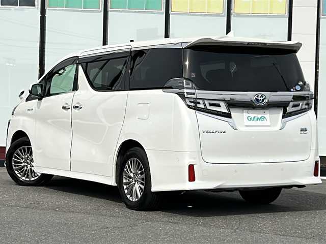 トヨタ ヴェルファイア ハイブリット ZR Gエディション 山形県 2019(令1)年 6.2万km ホワイトパールクリスタルシャイン 4WD/衝突被害軽減システム/サンルーフ/純正ナビ/（Bluetooth/CD/DVD/フルセグ)/BSM/レーダークルーズコントロール/AFS/全方位カメラ/フリップダウンモニター/両側パワースライドドア/レザーシート/JBLオーディオスピーカー/電動パーキングブレーキ/パーキングアシスト/電動リアゲート/シートメモリ/前後コーナーセンサー/D＋N席パワーシート/D＋N席シートヒーター/D＋N席エアシート/ステアリングヒーター/ビルトインETC2.0/電動格納ミラー/ウィンカーミラー/純正ホイール/純正フロアマット/オットマン/LEDヘッドライト/スマートキー