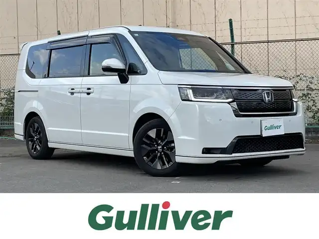 ホンダ ステップワゴン スパーダ 東京都 2024(令6)年 0.9万km プラチナホワイトパール ワンオーナー/純正11.4型ナビ/フルセグTV/CD/DVD/純正15.6型天吊モニター/アドバンスドルームミラー/ホンダセンシング/前席シートヒーター/両側電動ドア/電動リアゲート/ETC/前後ドライブレコーダー