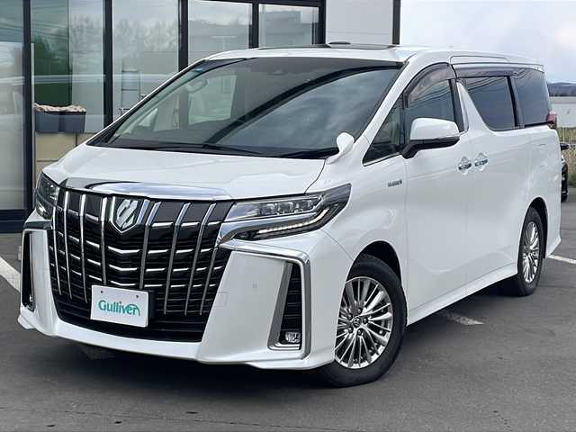 トヨタ アルファードハイブリット SR Cパッケージ 道東・釧路十勝 2019(令1)年 6.5万km ホワイトパールクリスタルシャイン ワンオーナー/ツインムーンルーフ/Toyota Safety Sense P/・プリクラッシュセーフティシステム/・レーンディパーチャーアラート/・アダプティブハイビームシステム/・レーダークルーズコントロール/プッシュスタート/MTモード付きAT/純正ナビ/フルセグTV/フリップダウンモニター/バックカメラ/ETC2.0/ドライブレコーダー ZDR 026/100V電源/レザーシート/パワーシート/運転席シートメモリー機能/オットマン/シートヒーター/シートベンチレーション/ステアリングヒーター/後席ロールサンシェード/両側パワースライドドア/パワーバックドア/LEDヘッドライト/ドアバイザー/17インチ純正アルミホイール/純正アルミホイール付きスタッドレスタイヤ４本車載