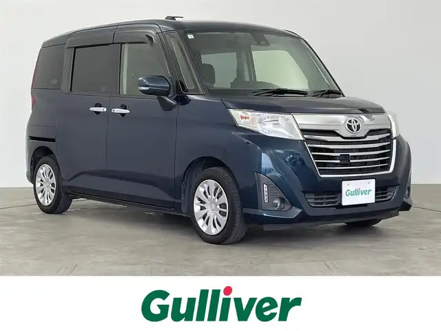 トヨタ ルーミー G－T 大分県 2018(平30)年 9.5万km レーザーブルークリスタルシャイン 純正ナビ/（フルセグ/CD/DVD/Bluetooth）　/ＥＴＣ　　/スマートアシスト/・衝突軽減ブレーキ/・誤発進抑制機能/・車線逸脱警報機能/両側パワースライドドア/DNシートヒーター/クルーズコントロール/ステアリングスイッチ/アイドリングストップ/オートライト　/ＬＥＤヘッドライト/スマートキー/プッシュスタート/電動格納ミラー