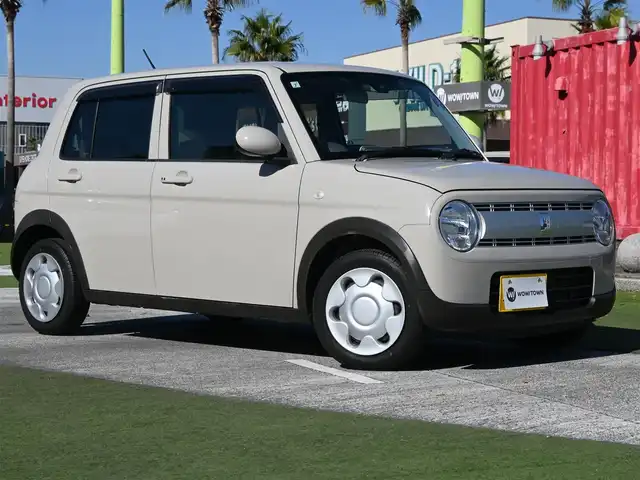 スズキ ラパン L 千葉県 2015(平27)年 2.9万km フォーンベージュM スズキセーフティサポート/アイドリングストップ/純正メモリーナビ/地デジTV/【DVD/CD再生機能　Bluetooth接続】/運転席シートヒーター/携帯リモコン