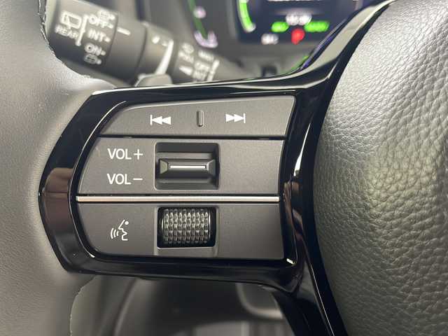 ホンダ ステップワゴン スパーダ eHEV 岐阜県 2025(令7)年 0.1千km プラチナホワイトパール 登録済み未使用車/純正11.4インチナビゲーション【LXM-247VFLi】/AppleCarplay /Android Auto/Bluetooth /CD DVD/フルセグテレビ/AM FM/SD/USB/革巻きステアリング/ステアリングリモコン/パドルシフト/メモリー機能付きパワーバックドア/ハーフレザーシート/シートヒーター(D/N席)/ ２列目シートオットマン/全列USBチャージャー付/両側パワースライドドア/LEDヘッドライト/ヘッドライトレベライザー/オートハイビーム/アダプティブドライビングビーム/スマートキー/プッシュスタート/スペアキー有/ホンダセンシング/先行車発進お知らせ機能/歩行者事故低減ステアリング/路外逸脱抑制機能/標識認識機能/渋滞追従機能付アダプティブクルーズコントロール（ACC）/車線維持支援システム（LKAS）/トラフィックジャムアシスト（渋滞運転支援機能）/ブラインドスポットインフォメーション/誤発進抑制機能/後方誤発進抑制機能/近距離衝突軽減ブレーキ/アクセル抑制機能/パーキングセンサーシステム/後退出庫サポート/減速セレクター