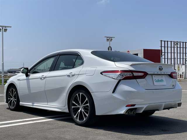 トヨタ カムリ WSレザーパッケージ 佐賀県 2019(令1)年 6.9万km プラチナホワイトパールマイカ 黒革シート/純正8インチSDナビ/・フルセグTV/CD/DVD/BD/SD/USB/Bluetooth/バックカメラ/前方ドライブレコーダー/ビルトインETC2.0/ヘッドアップディスプレイ/電子パーキングブレーキ/AUTO HOLD機能/D＋N席パワーシート/シートヒーター/ISOFIX対応/パドルシフト/革巻きステアリング/ステアリングリモコン/純正18インチアルミホイール/純正LEDヘッドライト/純正LEDフォグライト/純正フロアマット/トヨタセーフティセンス/・レーダークルーズコントロール/・プリクラッシュセーフティ/・レーンディパーチャーアラート/・ブラインドスポットモニター/・クリアランスソナー/・リヤクロストラフィックアラート/・タイヤ空気圧警報システム