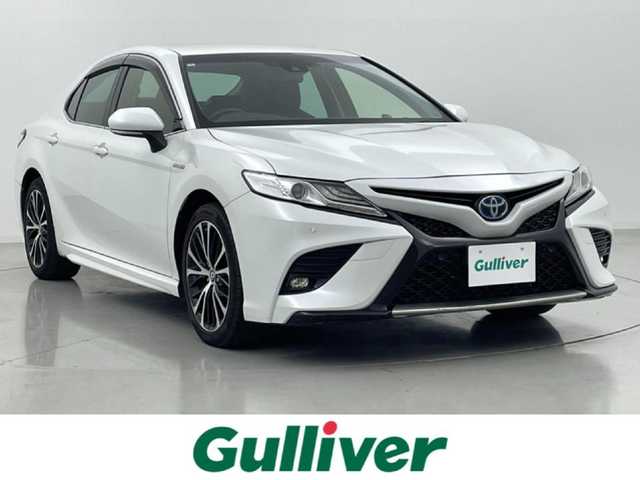 トヨタ カムリ WSレザーパッケージ 熊本県 2019(令1)年 6.9万km プラチナホワイトパールマイカ 黒革シート/純正8インチSDナビ/・フルセグTV/CD/DVD/BD/SD/USB/Bluetooth/バックカメラ/前方ドライブレコーダー/ビルトインETC2.0/ヘッドアップディスプレイ/電子パーキングブレーキ/AUTO HOLD機能/D＋N席パワーシート/シートヒーター/ISOFIX対応/パドルシフト/革巻きステアリング/ステアリングリモコン/純正18インチアルミホイール/純正LEDヘッドライト/純正LEDフォグライト/純正フロアマット/トヨタセーフティセンス/・レーダークルーズコントロール/・プリクラッシュセーフティ/・レーンディパーチャーアラート/・ブラインドスポットモニター/・クリアランスソナー/・リヤクロストラフィックアラート/・タイヤ空気圧警報システム/スマートキー/プッシュスタート/スペアキー1本/取扱説明書