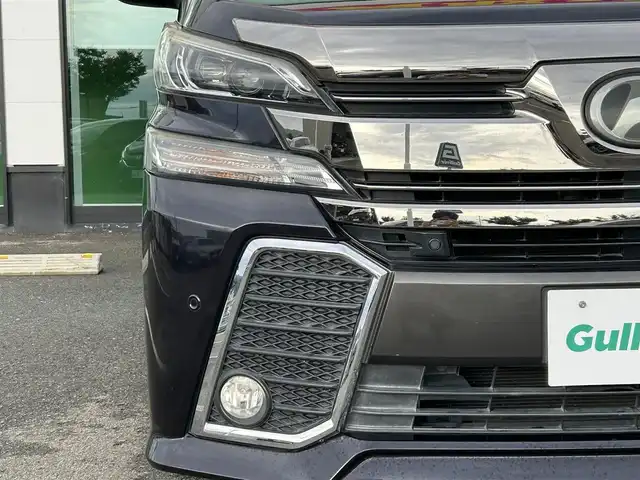 トヨタ ヴェルファイア Z Aエディション 和歌山県 2015(平27)年 6.3万km スパークリングブラックパールクリスタルシャイン 純正9インチナビ（NSZT-Y６４T)/バックカメラ/フルセグTV/BT/CD/DVD/衝突軽減ブレーキ/レーダークルコン/オートライト/前後コーナーセンサー/純正フリップダウンモニター/両側パワスラ/ビルトインETC/オットマン/LEＤヘッドライト/フォグランプ/１００V充電/純正18インチアルミ/純正フロアマット/プッシュスタート