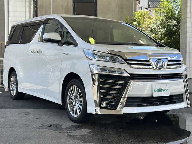 トヨタ ヴェルファイア ハイブリット Z 京都府 2019(平31)年 7.6万km ホワイトパールクリスタルシャイン 純正11インチSDナビ/フルセグTV/Bluetooth Audio/CD/DVD/Blu-ray/USB/HDMI/AUX/アラウンドビューモニター/JBLサウンドシステム/デジタルインナーミラー/フリップダウンモニター/レーダークルーズコントロール/ビルトインETC2.0/前方ドライブレコーダー(ZDR-024)/レーダー探知機/プッシュスタート/プリクラッシュセーフティシステム/パーキングサポートブレーキ/レーンキープアシスト/ロードサインアシスト/クリアランスソナー/BSM/電動パーキングブレーキ/電動格納ウィンカーミラー/オートリトラクタブルミラー/ステアリングスイッチ/オールオートパワーウィンドウ/フォグランプ