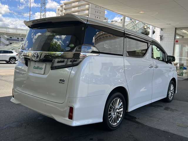 トヨタ ヴェルファイア ハイブリット Z 京都府 2019(平31)年 7.6万km ホワイトパールクリスタルシャイン 純正11インチSDナビ/フルセグTV/Bluetooth Audio/CD/DVD/Blu-ray/USB/HDMI/AUX/アラウンドビューモニター/JBLサウンドシステム/デジタルインナーミラー/フリップダウンモニター/レーダークルーズコントロール/ビルトインETC2.0/前方ドライブレコーダー(ZDR-024)/レーダー探知機/プッシュスタート/プリクラッシュセーフティシステム/パーキングサポートブレーキ/レーンキープアシスト/ロードサインアシスト/クリアランスソナー/BSM/電動パーキングブレーキ/電動格納ウィンカーミラー/オートリトラクタブルミラー/ステアリングスイッチ/オールオートパワーウィンドウ/フォグランプ