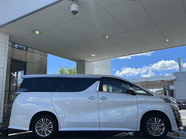 トヨタ ヴェルファイア ハイブリット Z 京都府 2019(平31)年 7.6万km ホワイトパールクリスタルシャイン 純正11インチSDナビ/フルセグTV/Bluetooth Audio/CD/DVD/Blu-ray/USB/HDMI/AUX/アラウンドビューモニター/JBLサウンドシステム/デジタルインナーミラー/フリップダウンモニター/レーダークルーズコントロール/ビルトインETC2.0/前方ドライブレコーダー(ZDR-024)/レーダー探知機/プッシュスタート/プリクラッシュセーフティシステム/パーキングサポートブレーキ/レーンキープアシスト/ロードサインアシスト/クリアランスソナー/BSM/電動パーキングブレーキ/電動格納ウィンカーミラー/オートリトラクタブルミラー/ステアリングスイッチ/オールオートパワーウィンドウ/フォグランプ