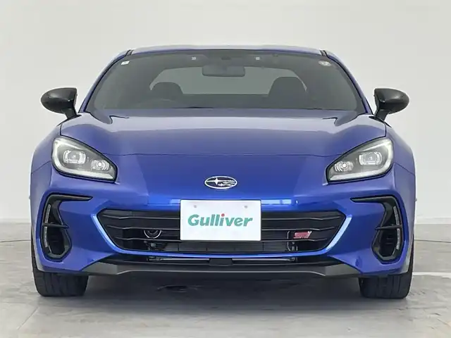 スバル ＢＲＺ STIスポーツ 群馬県 2024(令6)年 1.1万km WRブルーパール STIマフラー/STI Sport 専用装備　あり/・STIチューニング SACHS（ザックス）ダンパー（ZF製）&コイルスプリング/・18インチアルミホイール（ブラック塗装）/・STI製フレキシブルVバー/・STI製フレキシブルドロースティフナーフロント/・TFTカラーマルチインフォメーションディスプレイ付メーター/・アルカンターラ/本革シート（フロントシートヒーター付）/・SUBARU BRZ STI Sportエクステリア/［フロントバンパー、STIエンブレム（フロント&リヤ）、BRZエンブレム（ブラック）］フロントフェンダーガーニッシュ/＝＝＝＝/純正カロッツェリア9インチナビ（AVIC-CQ912)/・CD/DVD/USB/SD(MSV)/・HDMI/Bluetooth/フルセグTV/バックカメラ/アダプティブクルーズコントロール/リアビークルディテクション/ETC/LEDヘッドライト/オートライト /オートマチックハイビーム/スマートキー /プッシュスタート/バックソナー