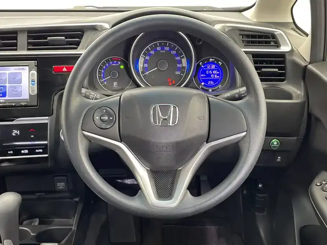 ホンダ フィット 13G Lパッケージ 栃木県 2014(平26)年 1.6万km プレミアムホワイトパール 純正メモリナビ/（CD/DVD/TV/Bluetooth/SD/AUX/iPod）/バックカメラ/前後ドライブレコーダー/禁煙車/オートライト/LEDヘッドライト/横滑り防止装置/スマートキー/プッシュスタート/アイドリングストップ/電動格納ミラー/純正フロアマット