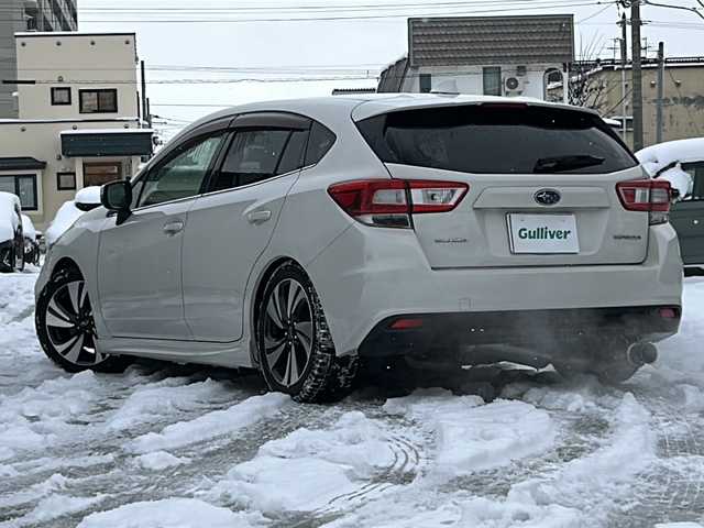 スバル インプレッサ スポーツ 2．0i－S アイサイト 道北・旭川 2016(平28)年 8.8万km クリスタルホワイトP /４ＷＤ//スマートキー//ローダウンサス（ＲＳＲ）　//社外マフラー（柿本）　//社外１９インチアルミ夏タイヤ積込み（5分）　//社外ポータブルナビ　//社外オーディオ（ＣＤ・ＵＳＢ・ＢＴ）　U382BT//社外ウーハー　//社外ドライブレコーダー//アイサイトＶｅｒ．３//レーダークルーズコントトール//先行車発進お知らせ//アクティブレーンキープ//車線逸脱警報・ふらつき警報//プリクラッシュブレーキ//ＡＴ誤発進後進抑制機能//ハイビームアシスト//ステアリングレスポンシブヘッドランプ　//リアビークルディテクション//ＬＥＤヘッドライト//オートライト・オートワイパー//パドルシフト//前席パワーシート//純正１７インチアルミホイール//保証書・取説//スペア×１