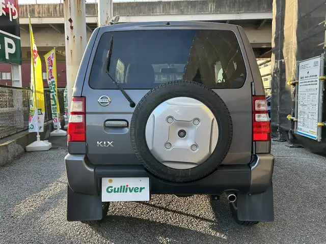 日産 キックス RX 千葉県 2009(平21)年 12.5万km ミディアムグレー 保証書、取扱説明書、スペアキー1本/FM/AM/CD/電動格納ミラー/ETC/ヘッドライト　ハロゲン/フォグライト　ハロゲン/シートヒーター/背面タイヤ/純正フロアマット/純正アルミホイール/サイドバイザー/4WD、寒冷地仕様