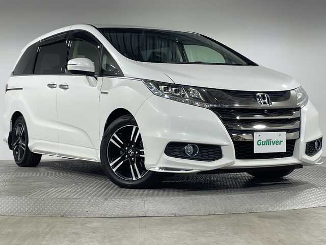 ホンダ オデッセイ ハイブリッド アブソルートセンシングEXパック 神奈川県 2016(平28)年 6.7万km ホワイトオーキッドパール ホンダセンシング/純正ナビ/・BT/フルセグTV/CD/DVD/HDMI/USB/全方位カメラ/両側電動スライドドア/ビルトインETC/前後ドライブレコーダー/ハーフレザーシート/パワーシート(D)/ECON/スマートキー/プッシュスタートボタン/革巻きステアリング/ステアリングスイッチ/Autoライト/LEDヘッドライト/フォグランプ/オットマン/電動格納ミラー/ウィンカーミラー/純正フロアマット/純正17インチアルミホイール/純正ドアバイザー