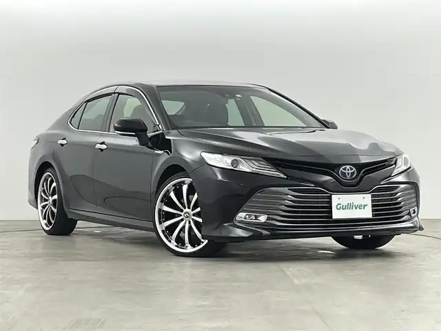 トヨタ カムリ G レザーパッケージ 福島県 2018(平30)年 7万km アティチュードブラックマイカ 純正SDナビゲーション/型式：B9108/【AM/FM/CD/DVD/SD/USB/AUX/Bluetooth/フルセグTV】/・バックカメラ/・純正ETC/衝突軽減ブレーキ/レーンキープアシスト/アダプティブクルーズコントロール/車線逸脱警報装置/電子パーキングブレーキ/・オートブレーキホールド/LEDヘッドライト/・オートライト/・フロントフォグライト/レザーシート/・運転席＋助手席パワーシート/・運転席＋助手席シートヒーター/ステアリングスイッチ/マニュアルモード付AT/社外20インチアルミホイール/電動格納ウィンカーミラー/・オートミラー/ABS/横滑り防止装置/盗難防止装置/プッシュスタート/・スマートキー