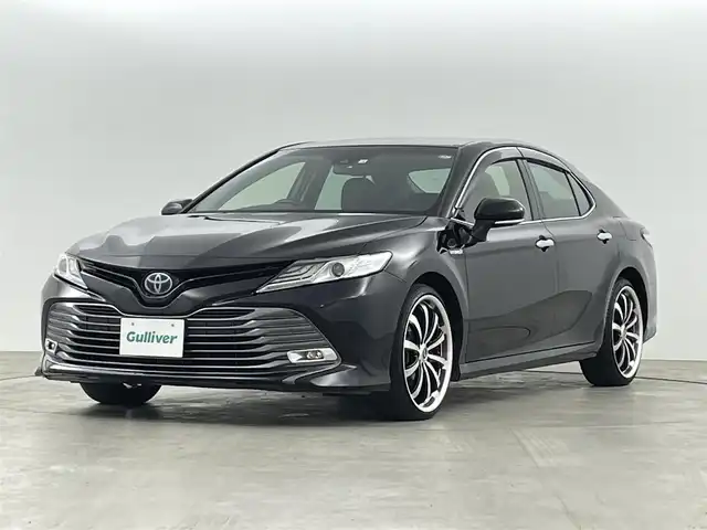 トヨタ カムリ G レザーパッケージ 福島県 2018(平30)年 7万km アティチュードブラックマイカ 純正SDナビゲーション/型式：B9108/【AM/FM/CD/DVD/SD/USB/AUX/Bluetooth/フルセグTV】/・バックカメラ/・純正ETC/衝突軽減ブレーキ/レーンキープアシスト/アダプティブクルーズコントロール/車線逸脱警報装置/電子パーキングブレーキ/・オートブレーキホールド/LEDヘッドライト/・オートライト/・フロントフォグライト/レザーシート/・運転席＋助手席パワーシート/・運転席＋助手席シートヒーター/ステアリングスイッチ/マニュアルモード付AT/社外20インチアルミホイール/電動格納ウィンカーミラー/・オートミラー/ABS/横滑り防止装置/盗難防止装置/プッシュスタート/・スマートキー