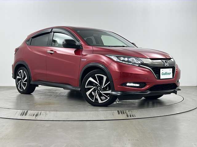 ホンダ ヴェゼル ハイブリッド RS ホンダセンシング 埼玉県 2017(平29)年 4.1万km プレミアムクリスタルレッドM 純正8インチナビ　VXM-175VFEi/バックカメラ/ETC/Honda SENSING/・衝突軽減ブレーキ/・アダプティブクルーズコントロール/・歩行者事故低減ステアリング/・路外逸脱抑制機能/・誤発進抑制機能/・先行車発進お知らせ機能/・標識認識機能/リアクティブフォースペダル/パドルシフト/運転席・助手席シートヒーター/スポーツモード/電子パーキングシステム/ブレーキホールド/アルミペダル/プッシュスタート/ステアリングリモコン/ウィンカーミラー/フロントフォグランプ/純正フロアマット/純正ドアバイザー/純正18インチアルミホイール
