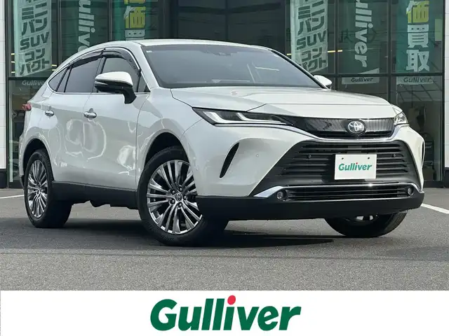 トヨタ ハリアー ハイブリッド Z 岡山県 2020(令2)年 8.1万km ホワイトパールクリスタルシャイン 登録時走行距離80210km/ワンオーナー/ガナドール製マフラー/JBLスピーカー/純正12.3インチナビ/フルセグTV/（FM.AM.TV.BT.USB）/トヨタセーフティセンス/・プリクラッシュセーフティ/・レーダークルーズコントロール/・オートマチックハイビーム/・ロードサインアシスト/バックカメラ/デジタルインナーミラー/ETC2.0/前後ドライブレコーダー/オートワイパー/横滑り防止装置/D席パワーシート/ハーフレザーシート/純正フロアマット/純正19インチAW