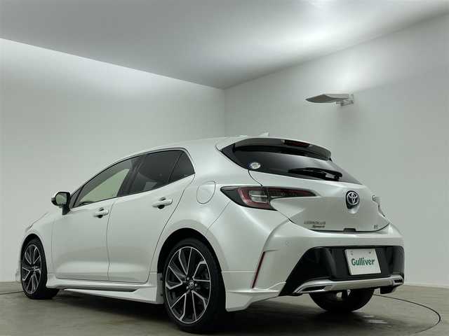 トヨタ カローラ スポーツ ハイブリッドG Z 岡山県 2020(令2)年 3.4万km プラチナホワイトパールマイカ モデリスタエアロ（フロント・サイド・リア）/ワンオーナー/純正9インチナビ/【フルセグ/Bluetooth/DVD】/純正18インチアルミホイール+サマータイヤ：装着/レーダークルーズコントロール/ビルトインETC/LEDヘッドライト（AUTO機能付き）/シートヒーター/横滑り防止機能/衝突軽減システム/車線逸脱防止システム/社外ドライブレコーダー/スマートキー/プッシュスタート/コーナーセンサー/純正フロアマット/ブラインドスポットモニター/USB接続