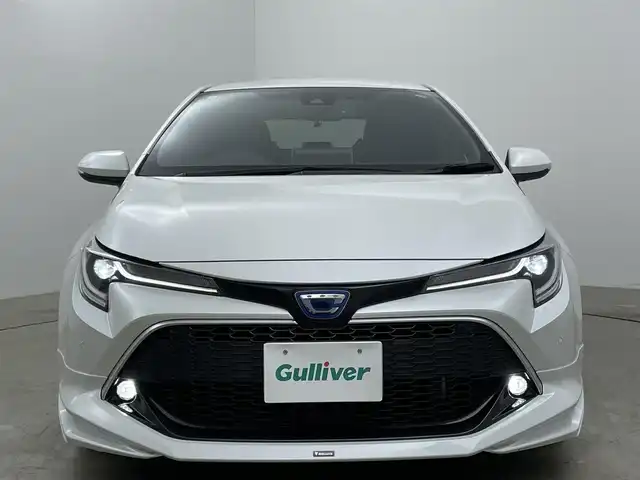 トヨタ カローラ スポーツ ハイブリッドG Z 岡山県 2020(令2)年 3.4万km プラチナホワイトパールマイカ モデリスタエアロ（フロント・サイド・リア）/ワンオーナー/純正9インチナビ/【フルセグ/Bluetooth/DVD】/純正18インチアルミホイール+サマータイヤ：装着/レーダークルーズコントロール/ビルトインETC/LEDヘッドライト（AUTO機能付き）/シートヒーター/横滑り防止機能/衝突軽減システム/車線逸脱防止システム/社外ドライブレコーダー/スマートキー/プッシュスタート/コーナーセンサー/純正フロアマット/ブラインドスポットモニター/USB接続