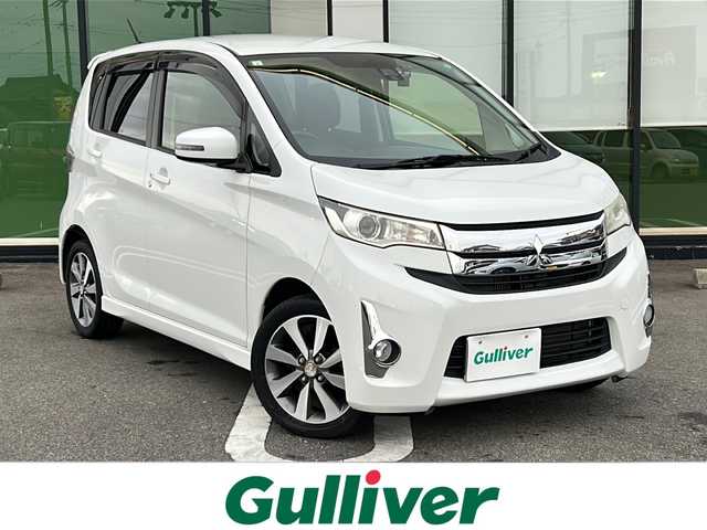 三菱 ｅＫカスタム T e－アシスト 岐阜県 2015(平27)年 6.8万km シルキーホワイト 登録時走行距離67209km/社外ナビ/バックモニター/フルセグテレビ/ドライブレコーダー/ターボチャージャー/LEDヘッドライト/スマートキー/プッシュスタート/オートライト/純正アルミホイール/純正フロアマット/禁煙車/ipod接続/ドアバイザー