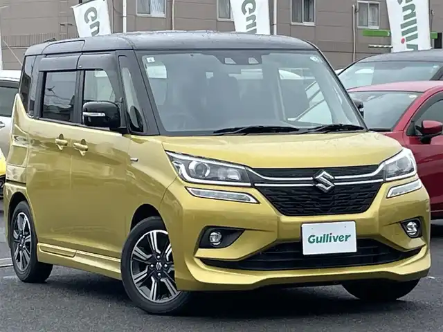 スズキ ソリオ バンディット HV MV 広島県 2019(令1)年 2.5万km ラッシュイエローメタリック/ブラック2トーンルーフ 登録時走行距離/　25105km/ワンオーナー/社外ナビ(CN-RZ743W)/　【CD/DVD/BT/フルセグTV】/クルーズコントロール(追従走行有り)/衝突被害軽減ブレーキ/車線逸脱警報/横滑り防止/シートヒーター/ビルトインETC/パドルシフト/オートライト/LEDライト/フォグランプ/スマートキー/プッシュスタート/アイドリングストップ/純正アルミホイール 15インチ/ドアバイザー/ウインカーミラー/純正フロアマット/スペアキー×1【スマートキー】/取扱説明書