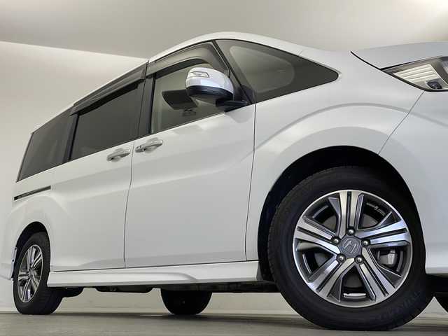 ホンダ ステップワゴン スパーダ eHEV G EXホンダS 新潟県 2020(令2)年 5.6万km プラチナホワイトパール ディーラー純正9インチナビ/(CD.DVD.SD.フルセグ.Bluetooth)/バックカメラ/ステアリングリモコン/LEDオートライト/両側パワースライドドア/ドライブレコーダー/ハーフレザーシート/前席シートヒーター/レーダークルーズコントロール/レーンキープアシスト/プッシュスタート/スマートキー×2/純正フロアマット