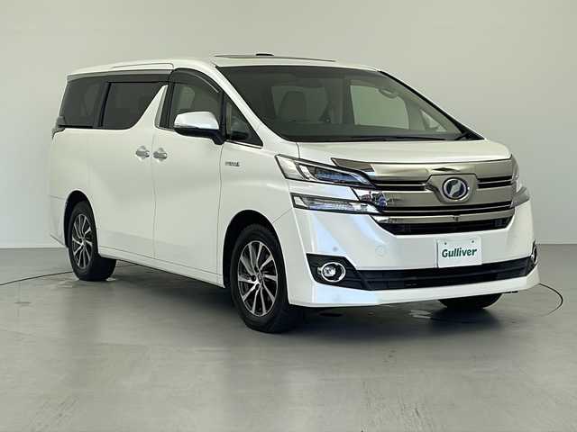 トヨタ ヴェルファイア ハイブリット エグゼクティブ ラウンジ 岐阜県 2015(平27)年 4万km ホワイトパールクリスタルシャイン 純正メーカーナビ　/フルセグＴＶ　/純正リアエンターテイメントシステム/パノラミックビューモニター　/ＪＢＬプレミアムサウンドシステム　/ツインムーンルーフ　/レーダークルーズコントロール　/シートヒーター/プリクラッシュセーフティセンス/両側パワースライドドア/パワーバックドア/スペアタイヤ/ビルトインETC/純正アルミホイル/ハンドルヒーター/スペアタイヤ/エンジンスタートボタン/電子パーキング/ホールド機能
