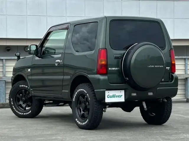 スズキ ジムニー ランドベンチャー 静岡県 2015(平27)年 9.4万km クールカーキPM 特別仕様車/５速ＭＴ/４ＷＤ/純正メモリナビ/フルセグＴＶ/ＤＶＤ再生/ＢＴオーディオ/ＥＴＣ/ハーフレザーシート/シートヒーター/背面タイヤ/ホワイトレタータイヤ/背面タイヤ・ハードカバー付き/ハロゲンヘッドライト/純正フロアマット/RAYS１６ＡＷ